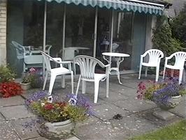 Andrew and Heather's sun lounge in Combe Martin serves as a very comfortable cafe for us this morning
